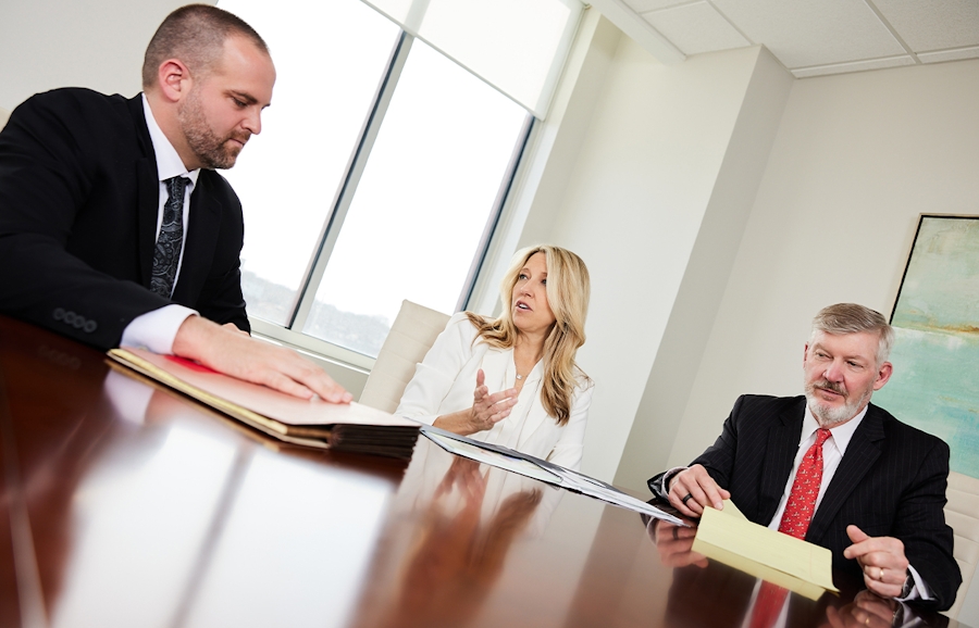 Matt, Jill, and Kirk in conference