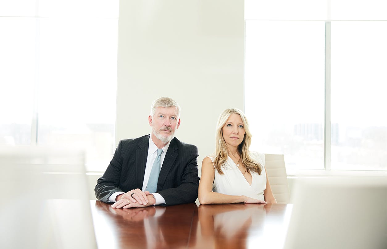 Kirk and Jill Presley at conference table
