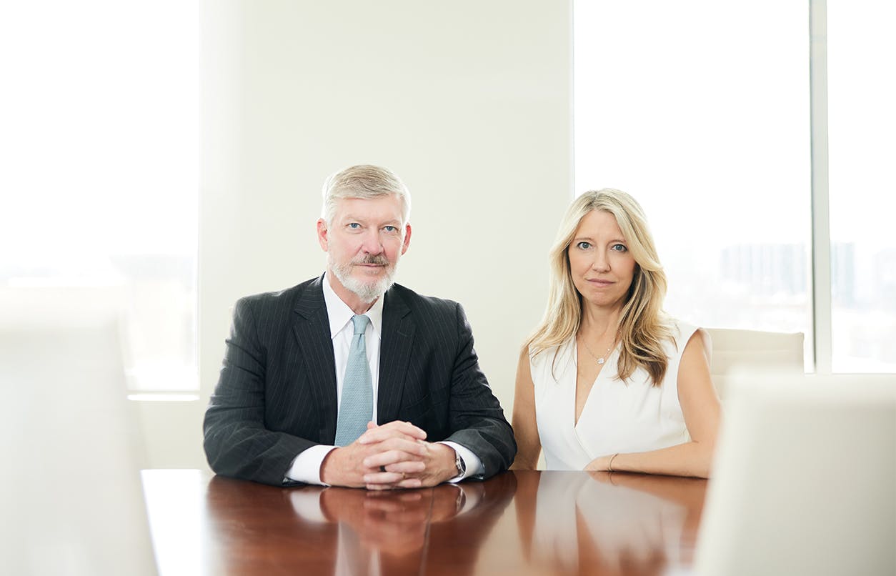 Kirk and Jill Presley at conference table