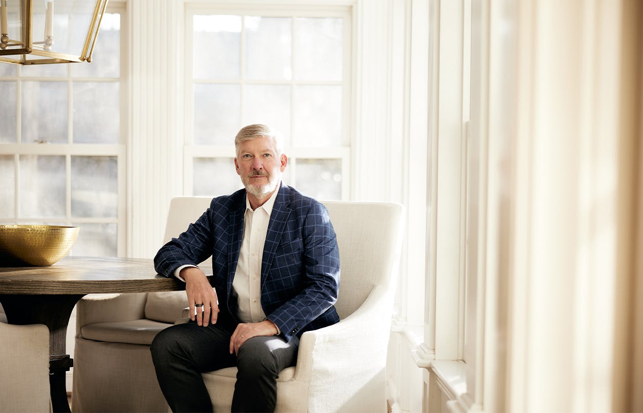 Kirk Presley in chair near window
