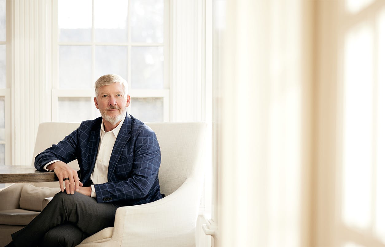 Kirk Presley in chair near window