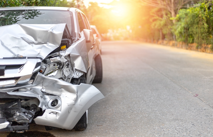 car accident with sun in the background