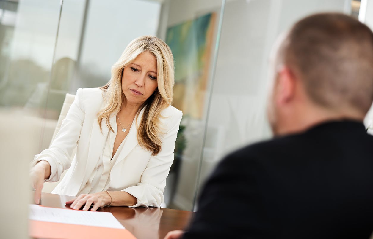 Jill Presley in conference with client