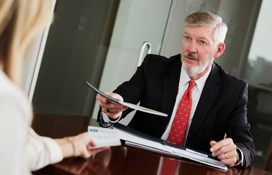 Kirk Presley handing over document