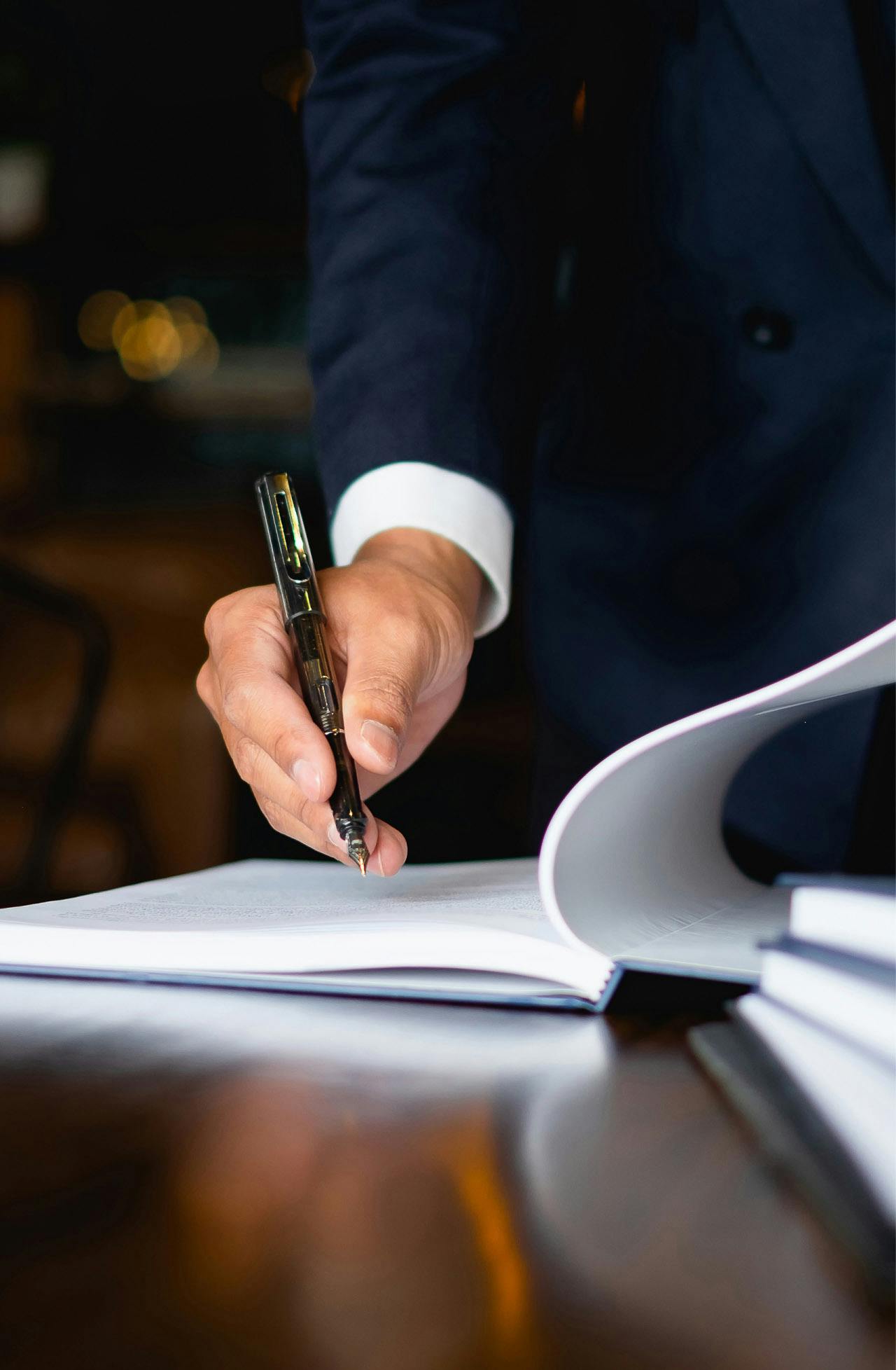 a man signing a document