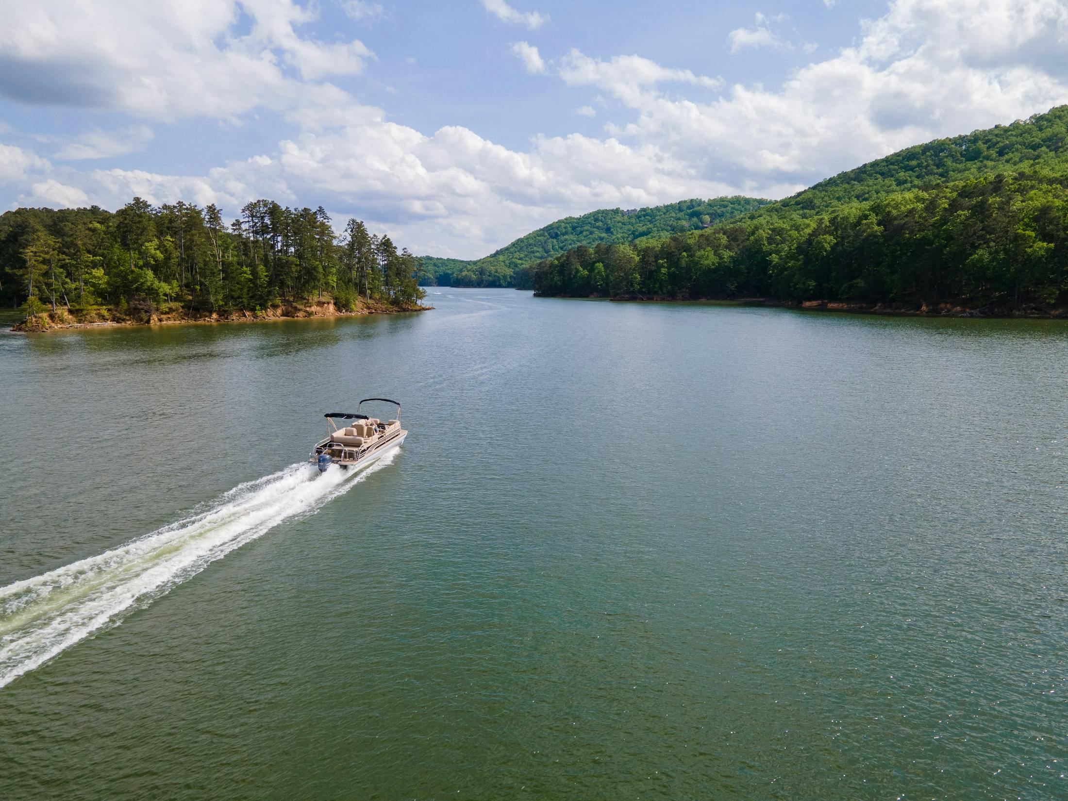 boat driving on a river