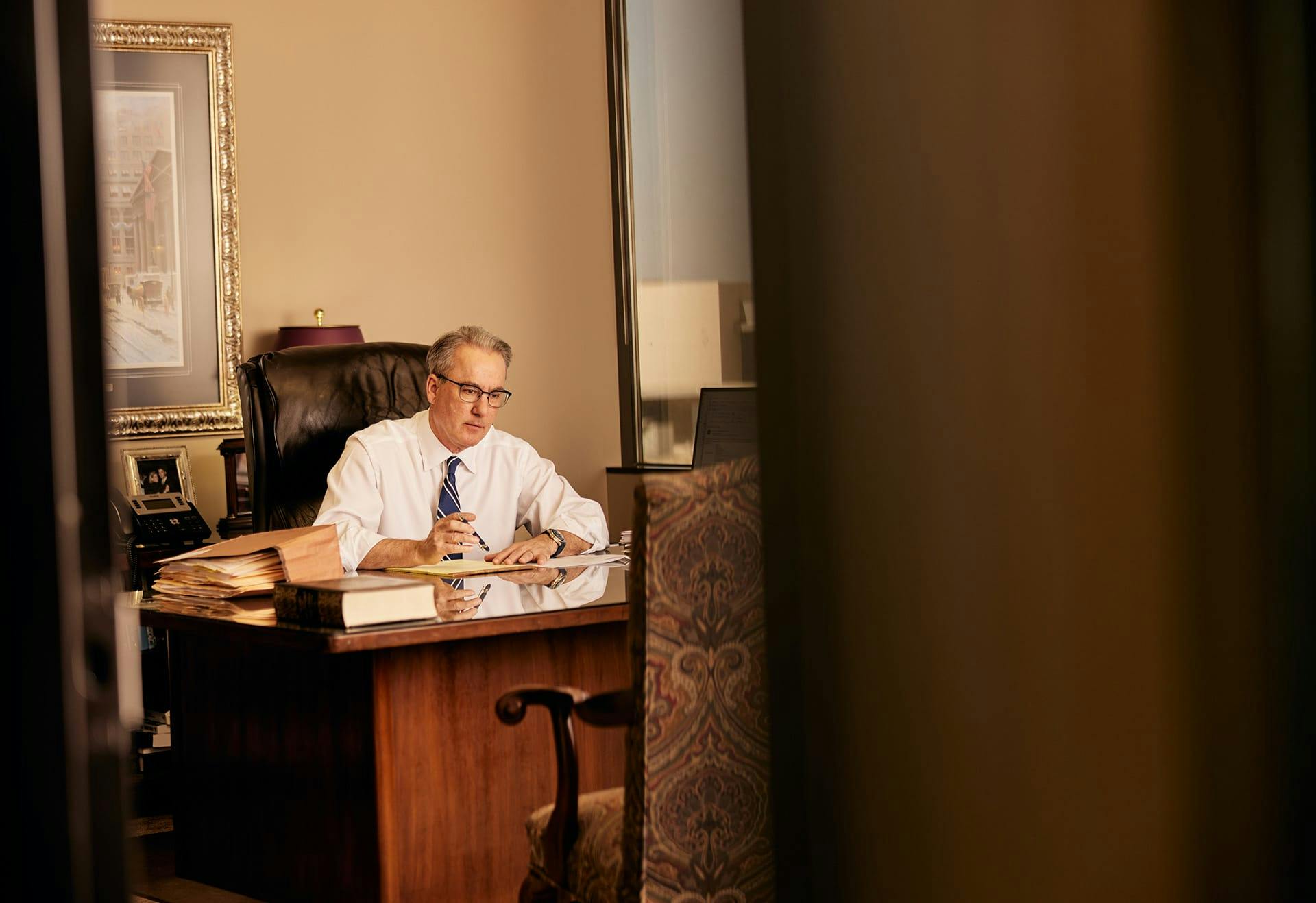 James Belote working in his office.