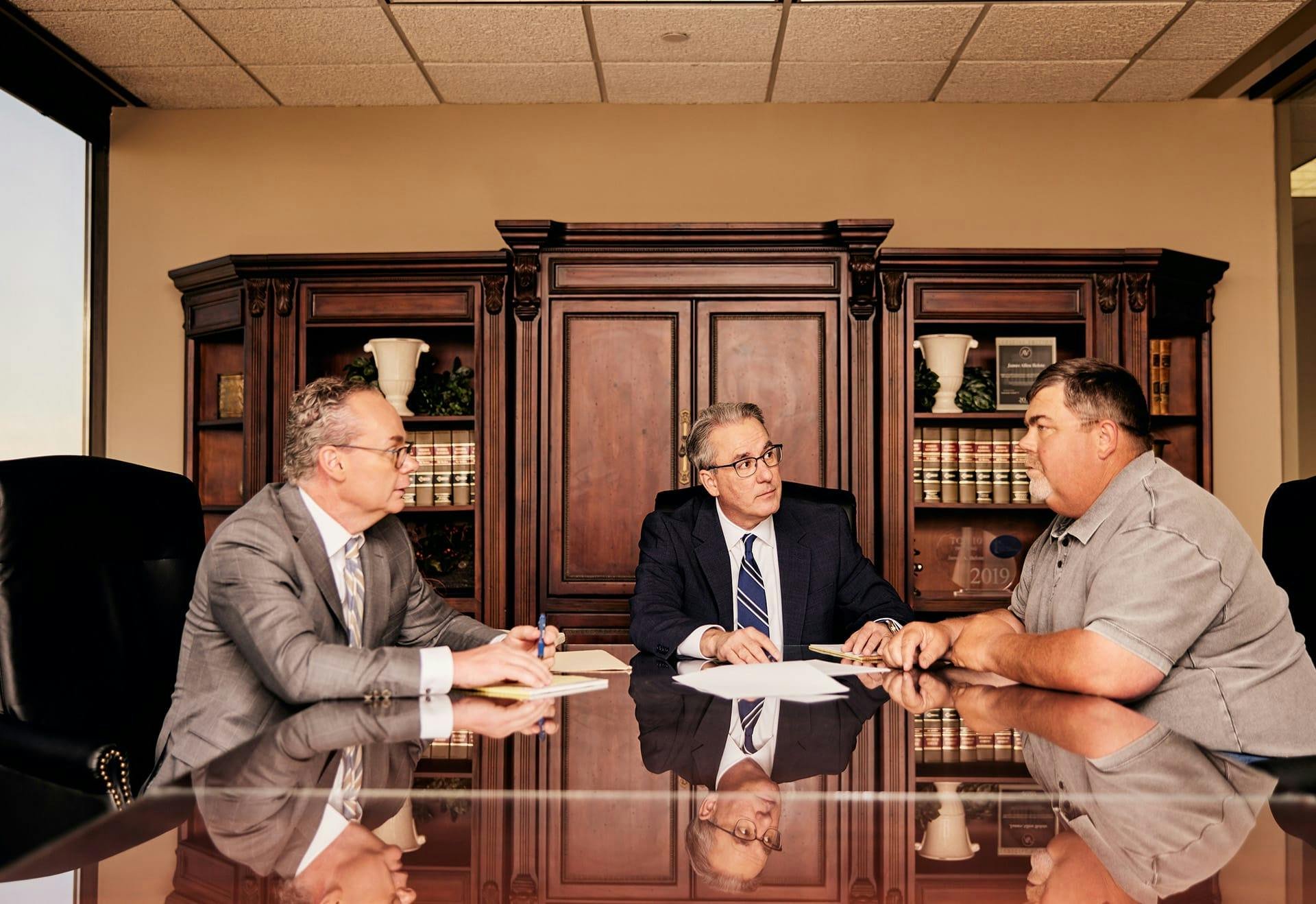 Stipe and Belote talking to a man