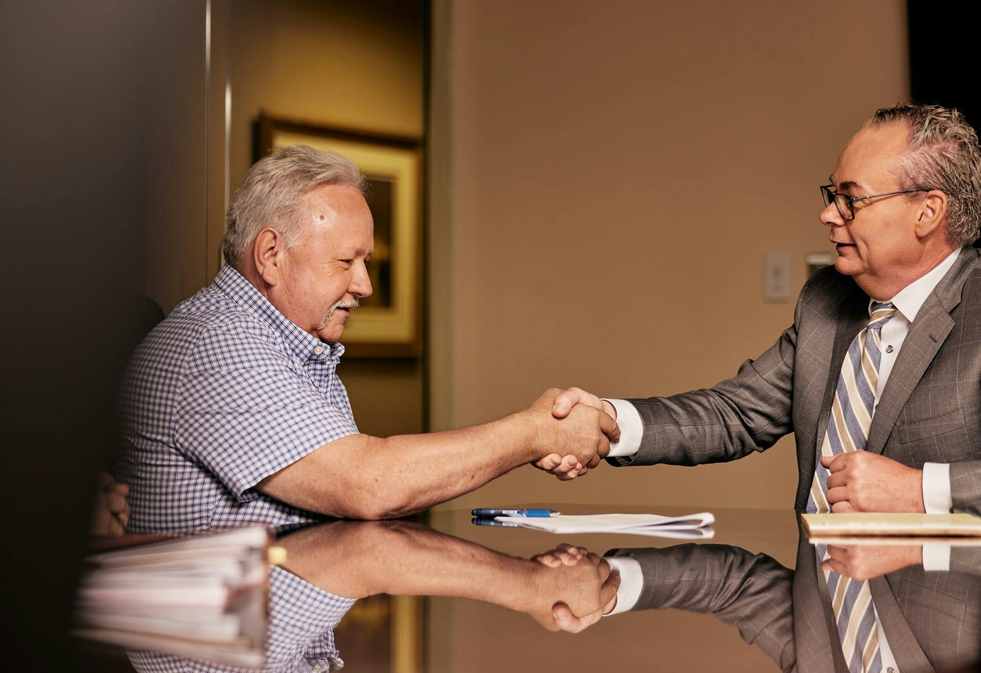 Jack Stipe shaking hands with a man