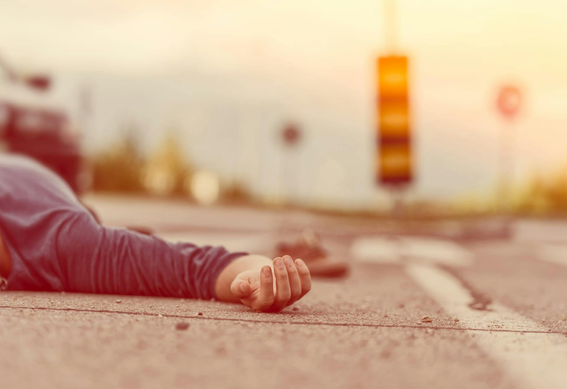 man lying in road