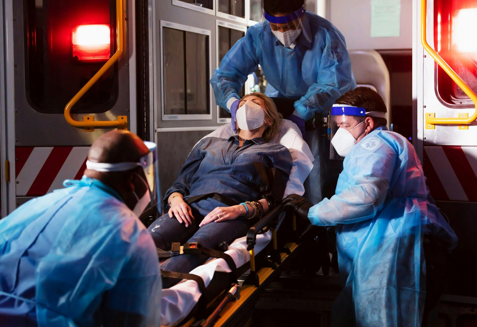paramedics helping person on stretcher