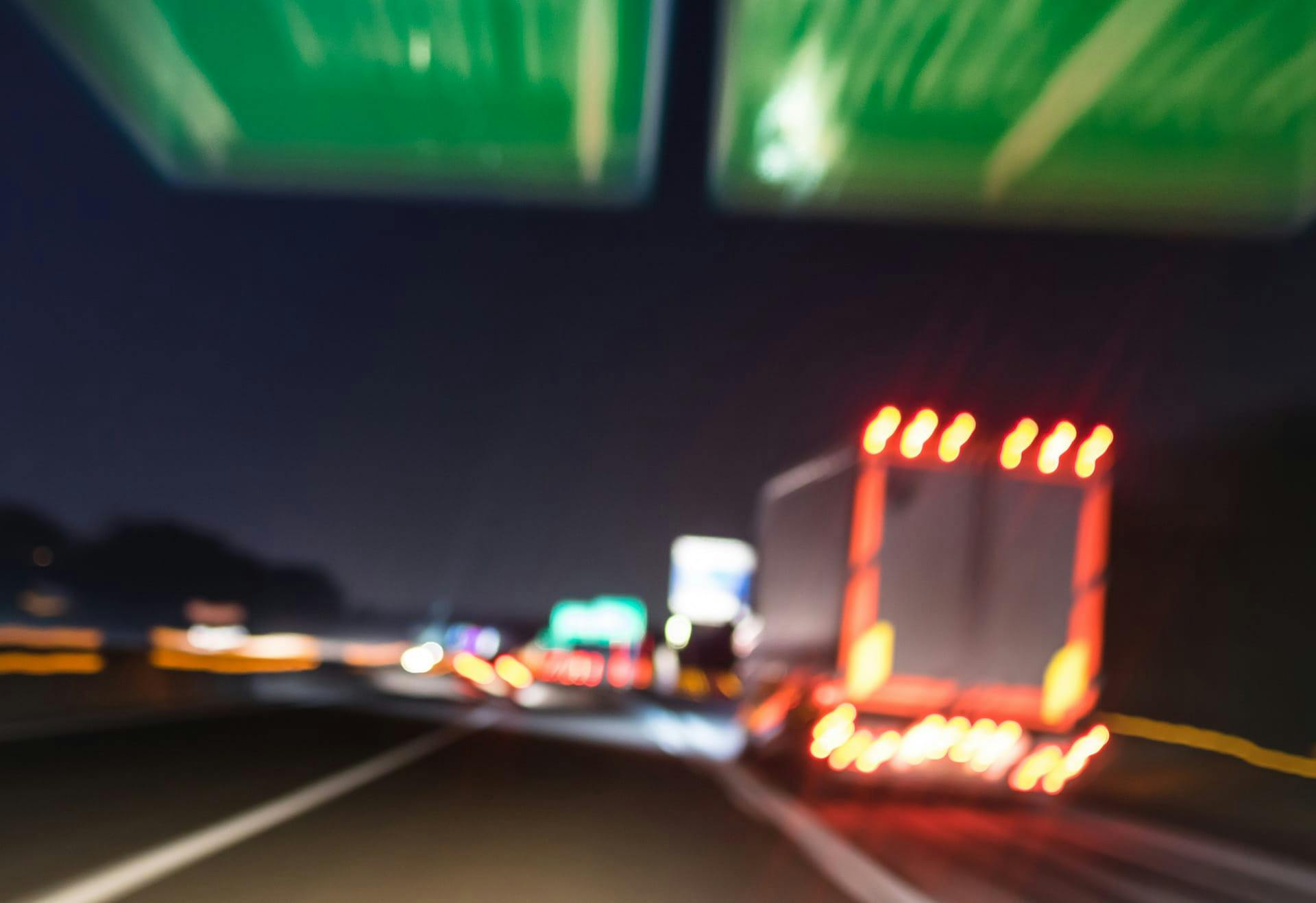 trucks on freeway at night