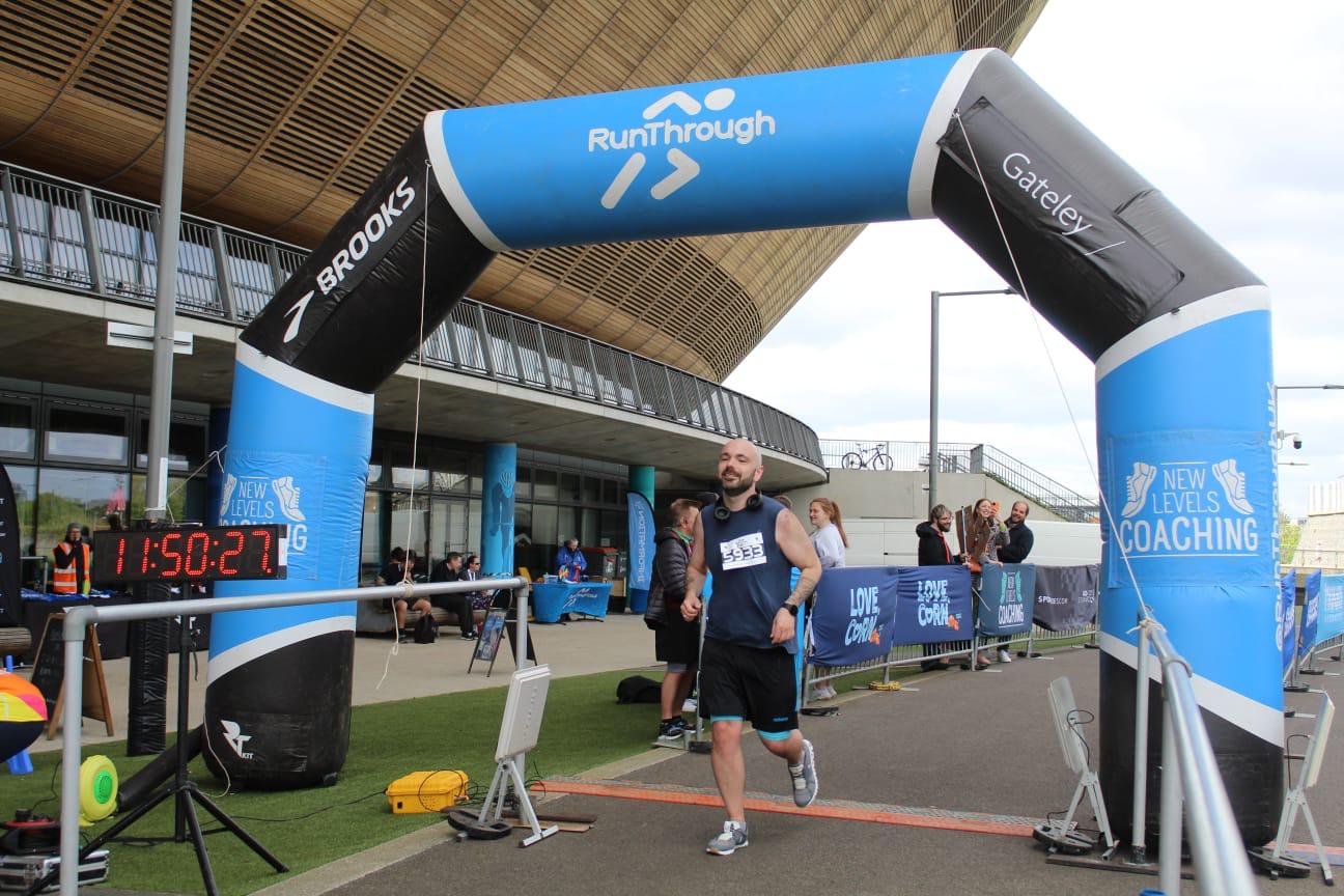 An image of Andrew finishing his half marathon