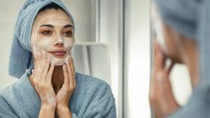 woman washing her face