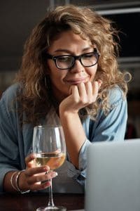 woman drinking a glass of wine