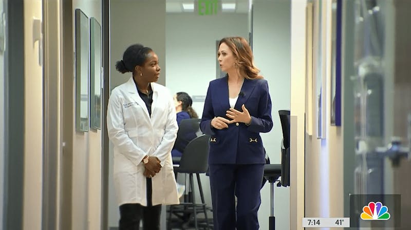 women walking down a hallway