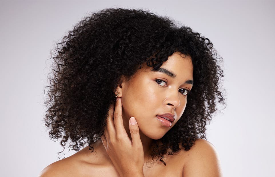 Woman looking at her earlobe