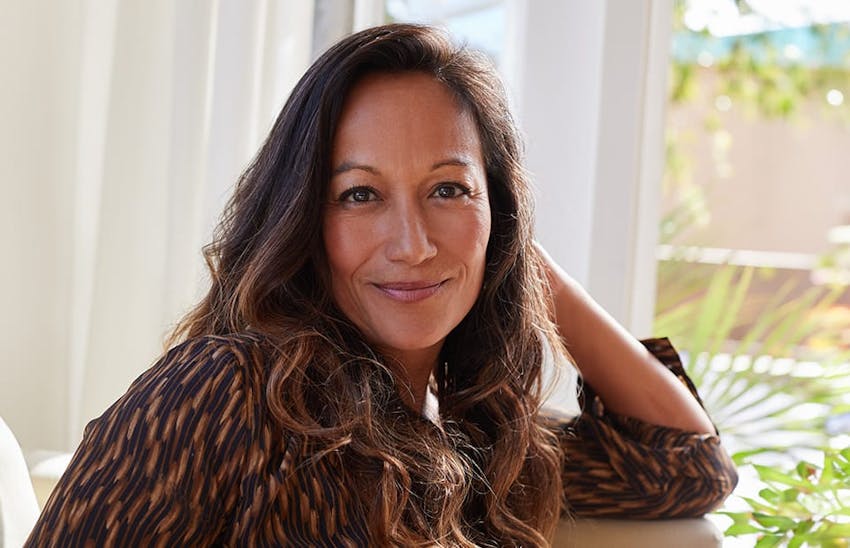 Woman leaning on windowsill