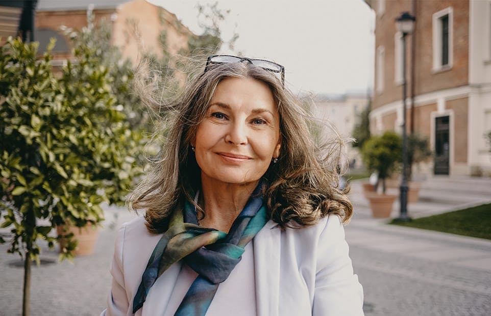 Woman smiling outdoors