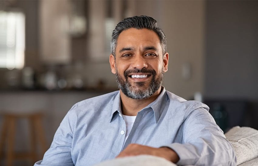 Man smiling on the couch