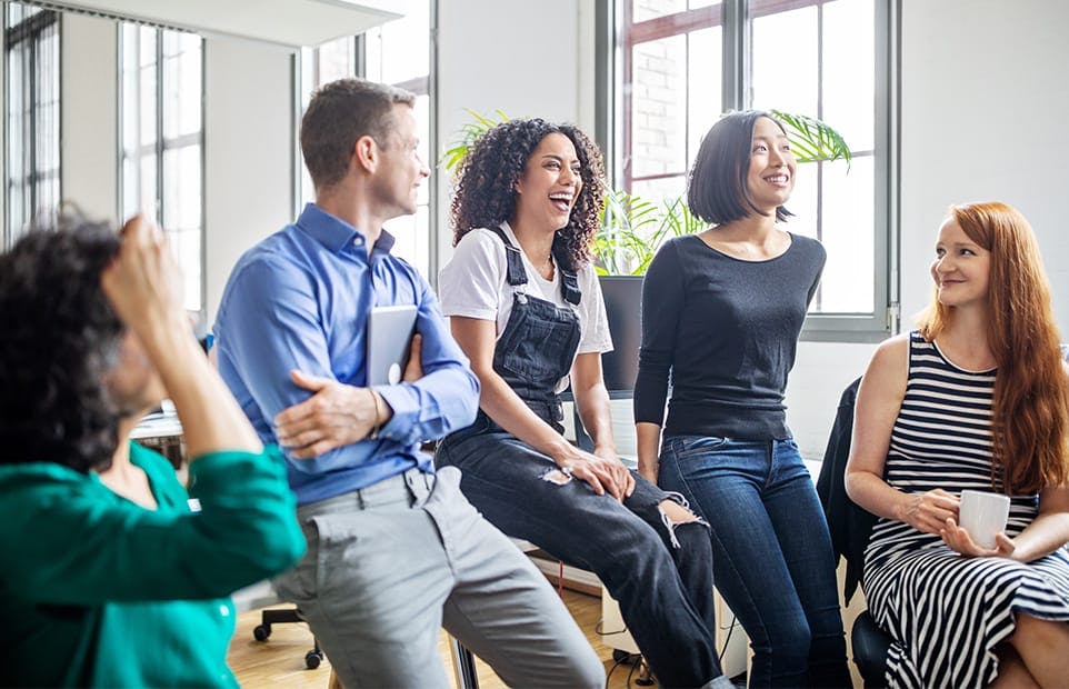 Group of people laughing and smiling