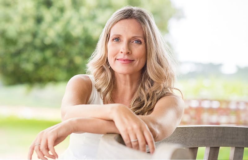 Woman smiling outdoors