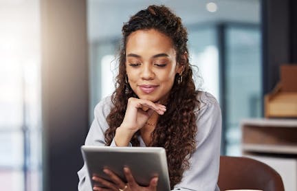 Woman reading on tablet