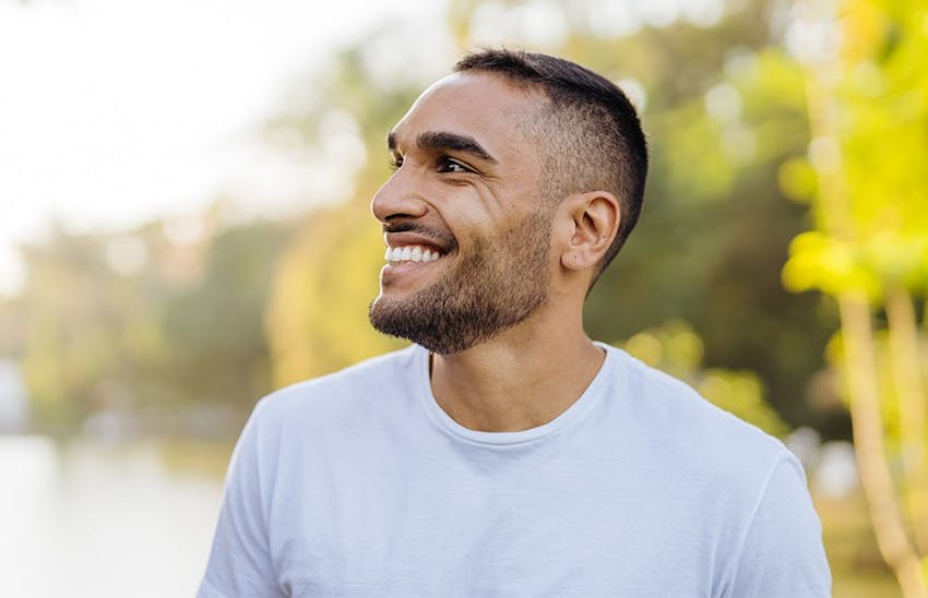 Man smiling outdoors