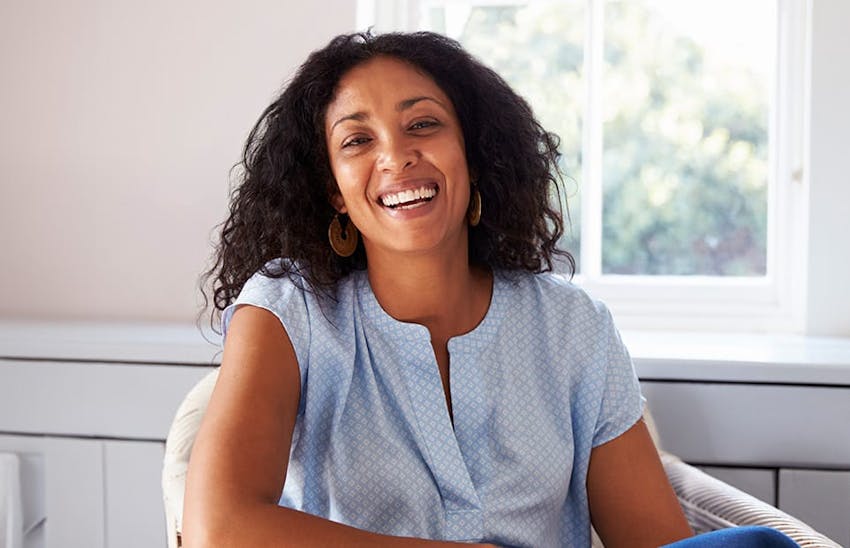 Smiling woman sitting in chair