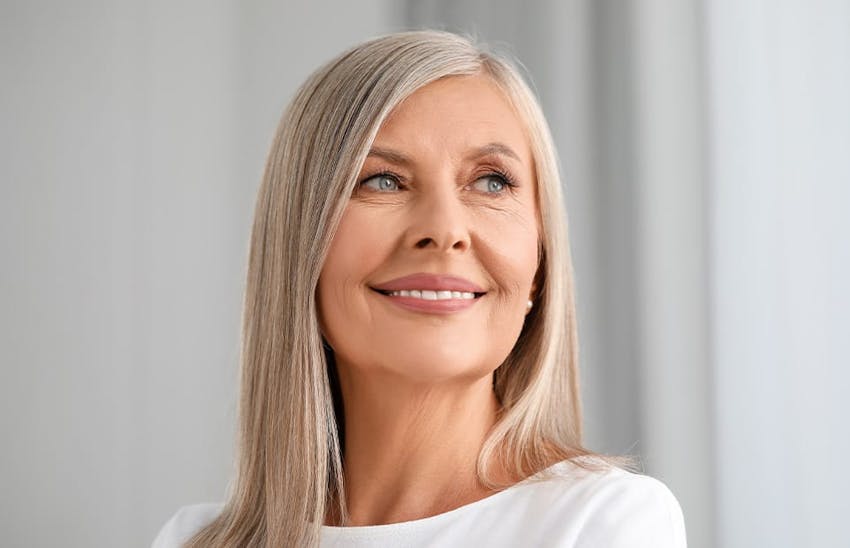 Woman smiling out of frame