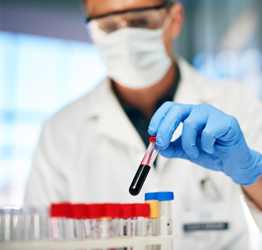 Man in lab with blood sample