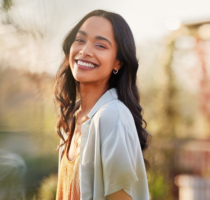 Woman smiling over her shoulder