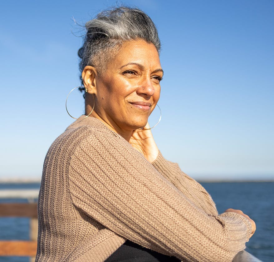 Woman sitting on pier