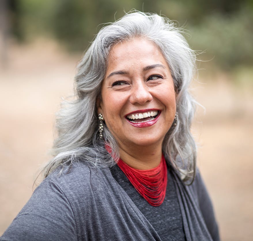 woman laughing outdoors