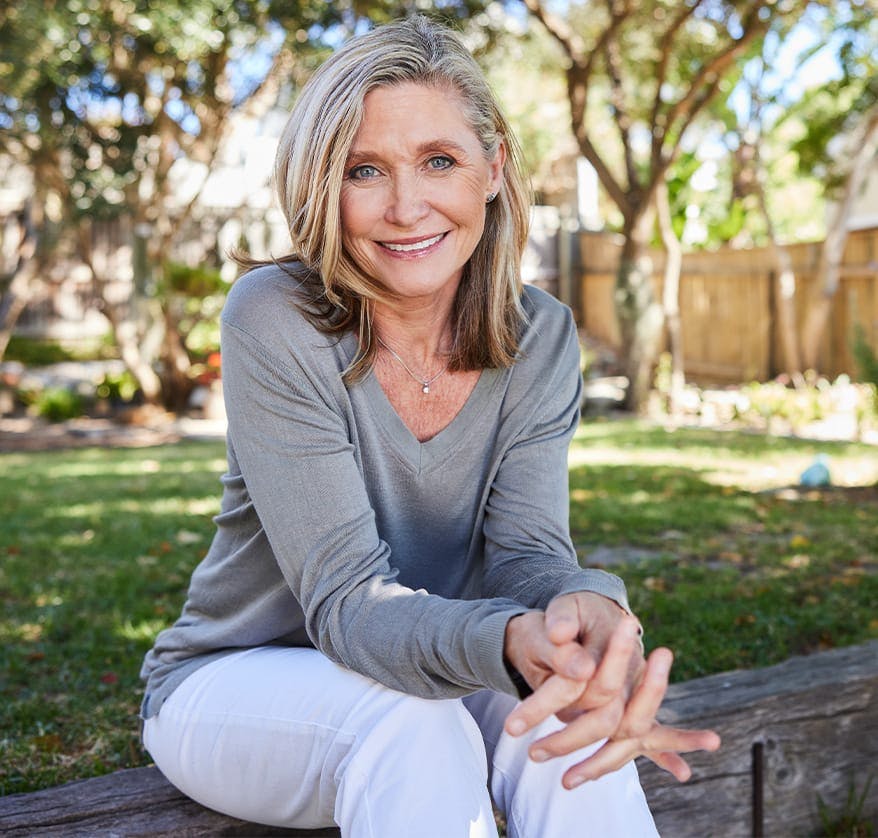 Woman sitting on bench outside