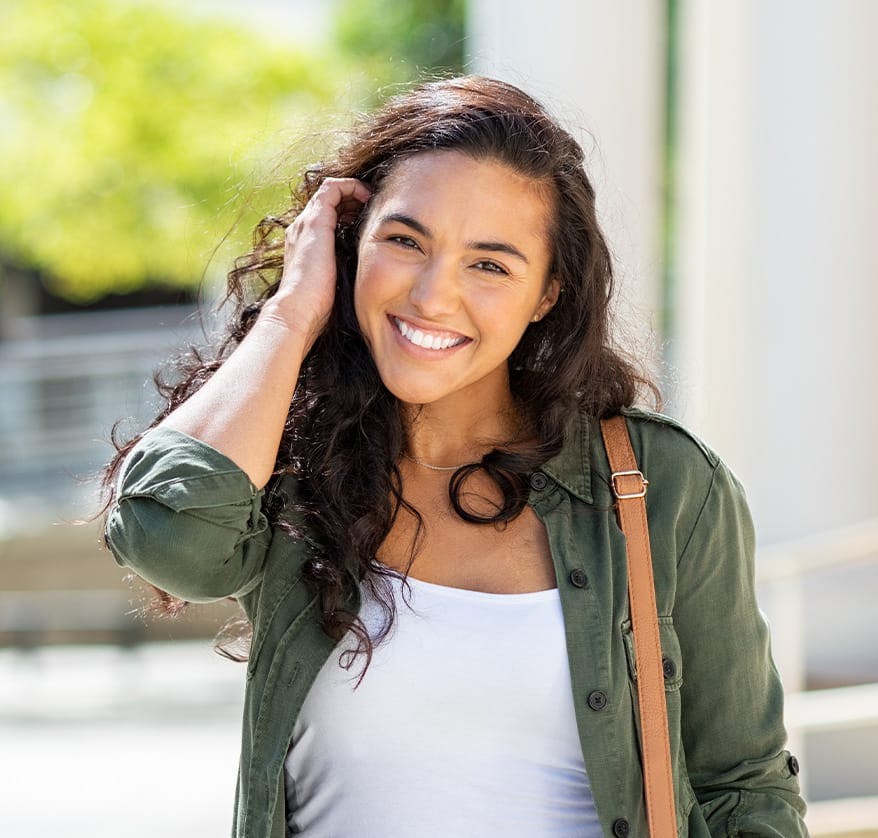 Woman smiling outdoors