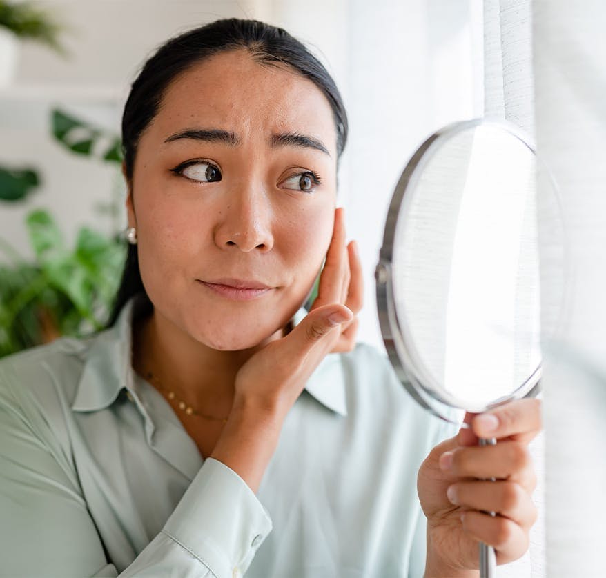 Woman looking at mirror