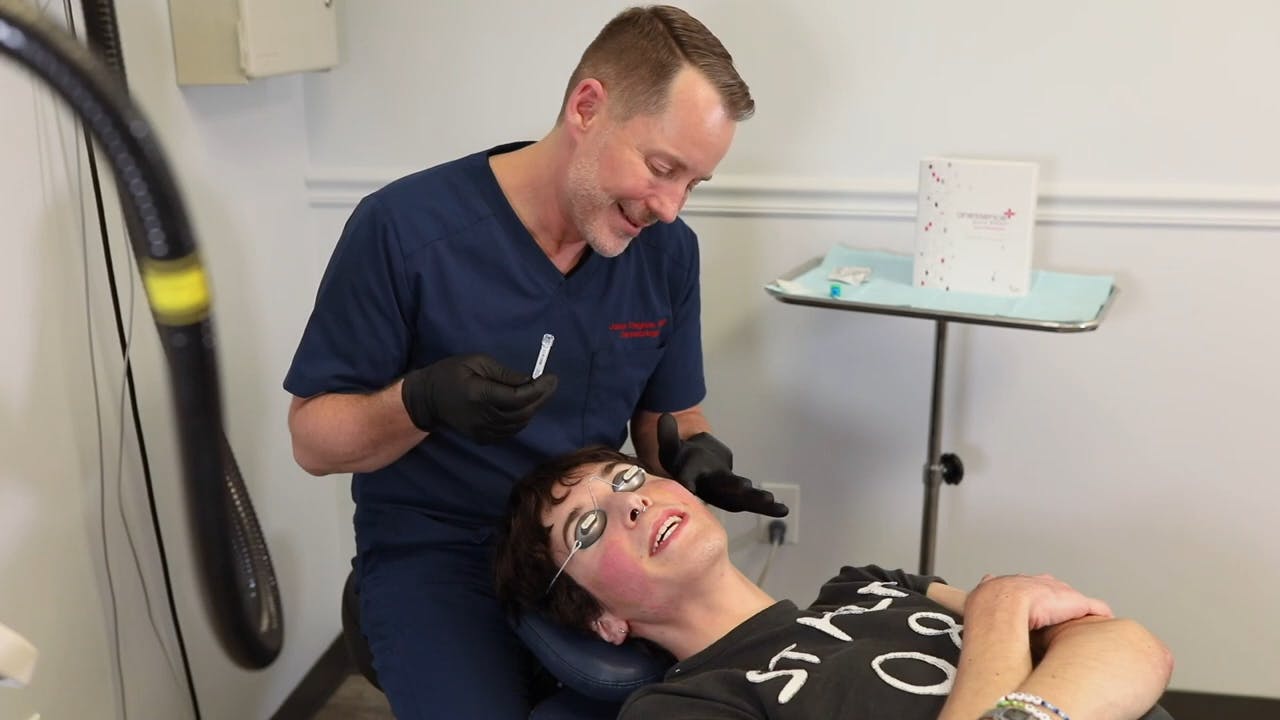 Dr. Jason working on a female patient