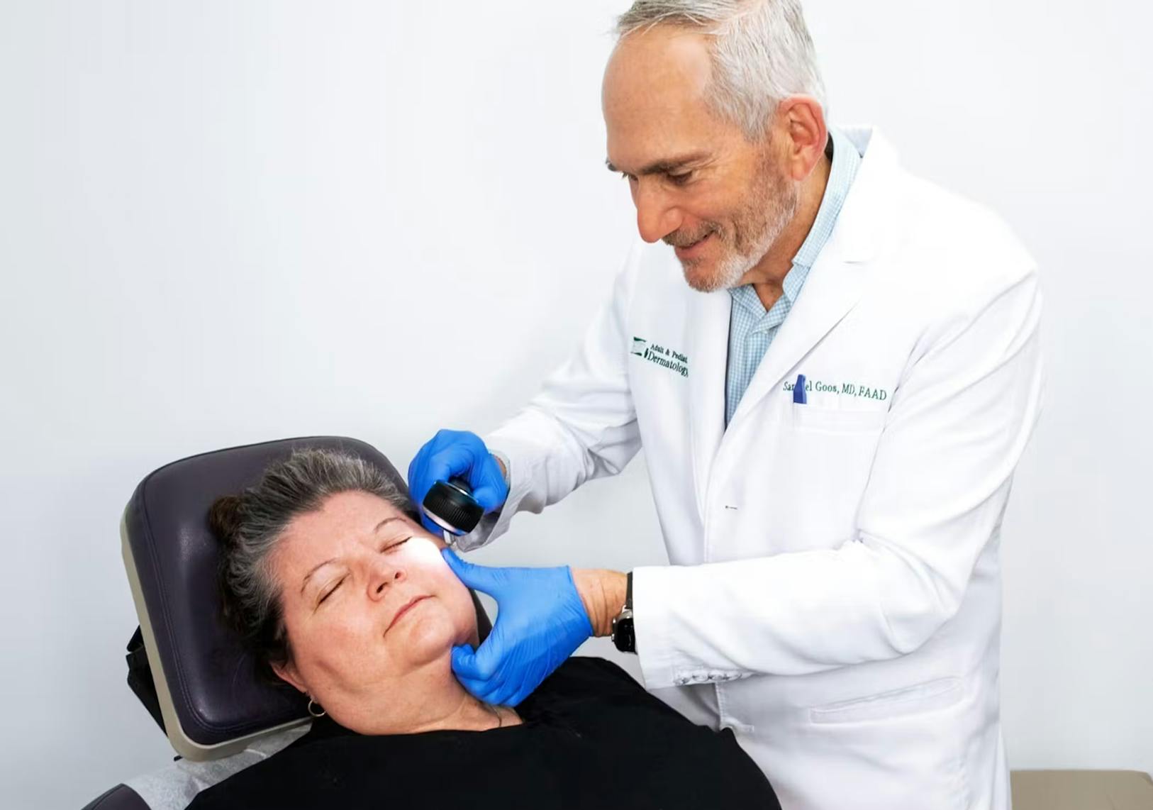 Doctor performing a procedure on a patient.