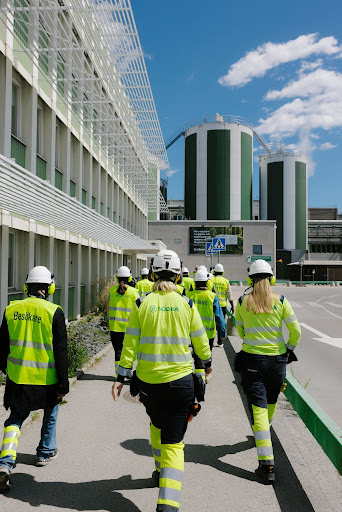 Visitors are given a tour of the exterior of the facilities