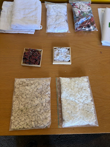 A table displayes several pulp variations of different sizes and textures