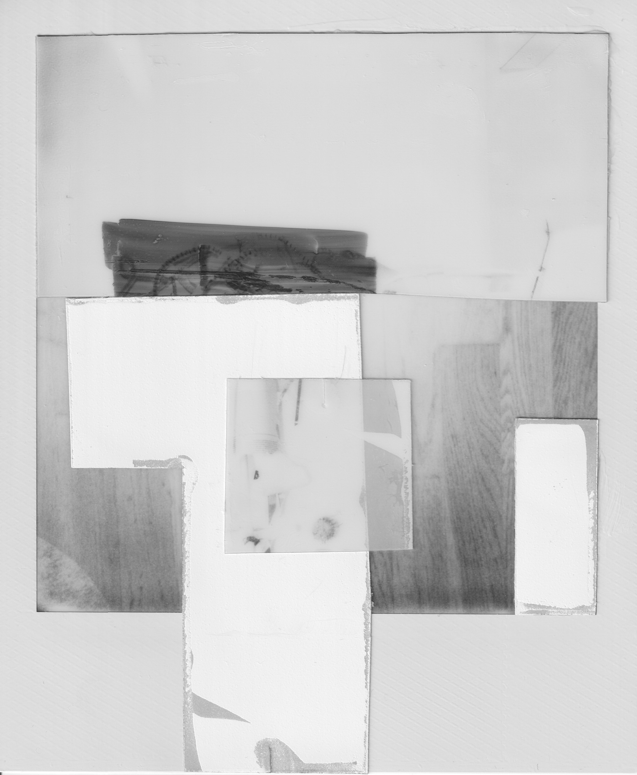 A black and white collage of Polaroid photographs depicting a parquet floor.