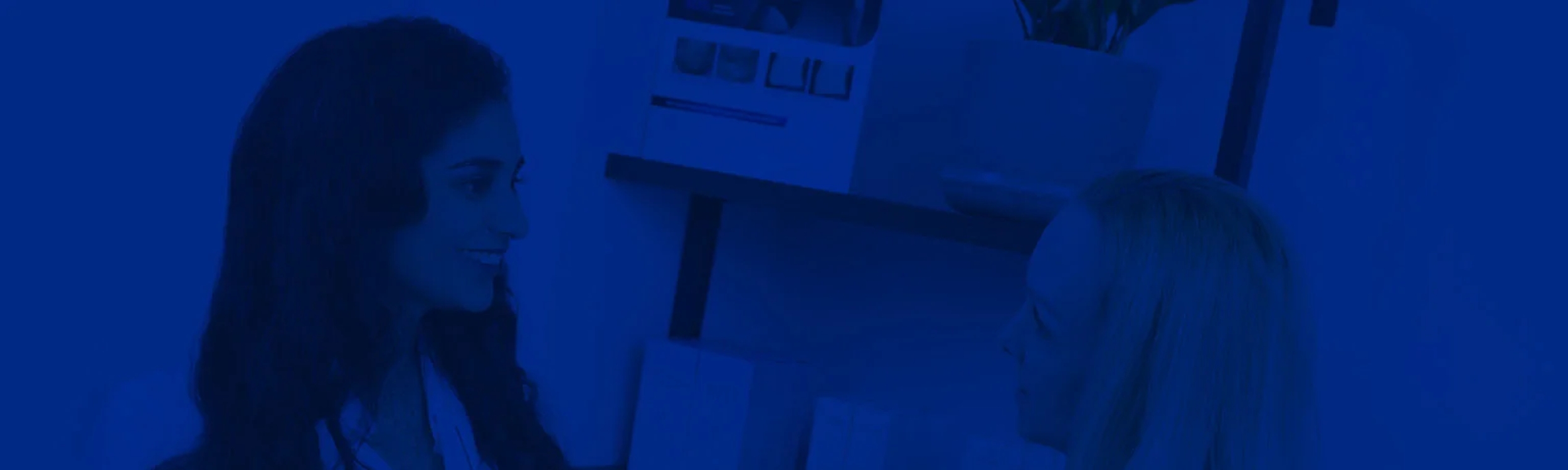 Banner image showing Dr. Maghera discussing with a patient about her treatment options.