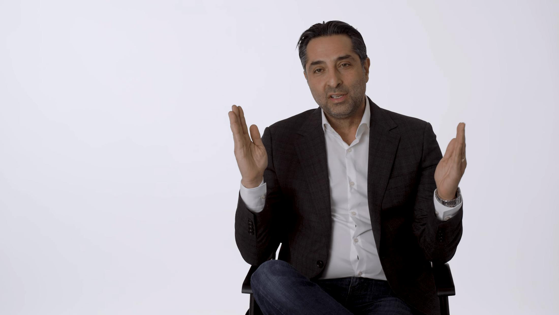 Dr. Rahban holding up his hands