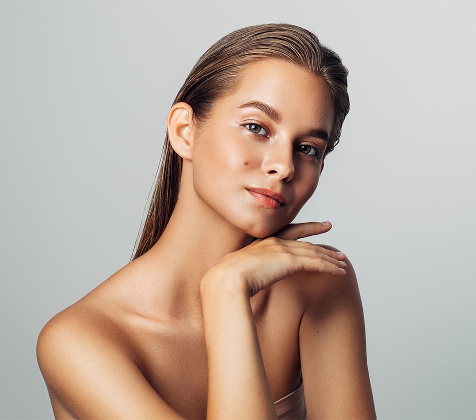 woman touching her chin with the back of her hand