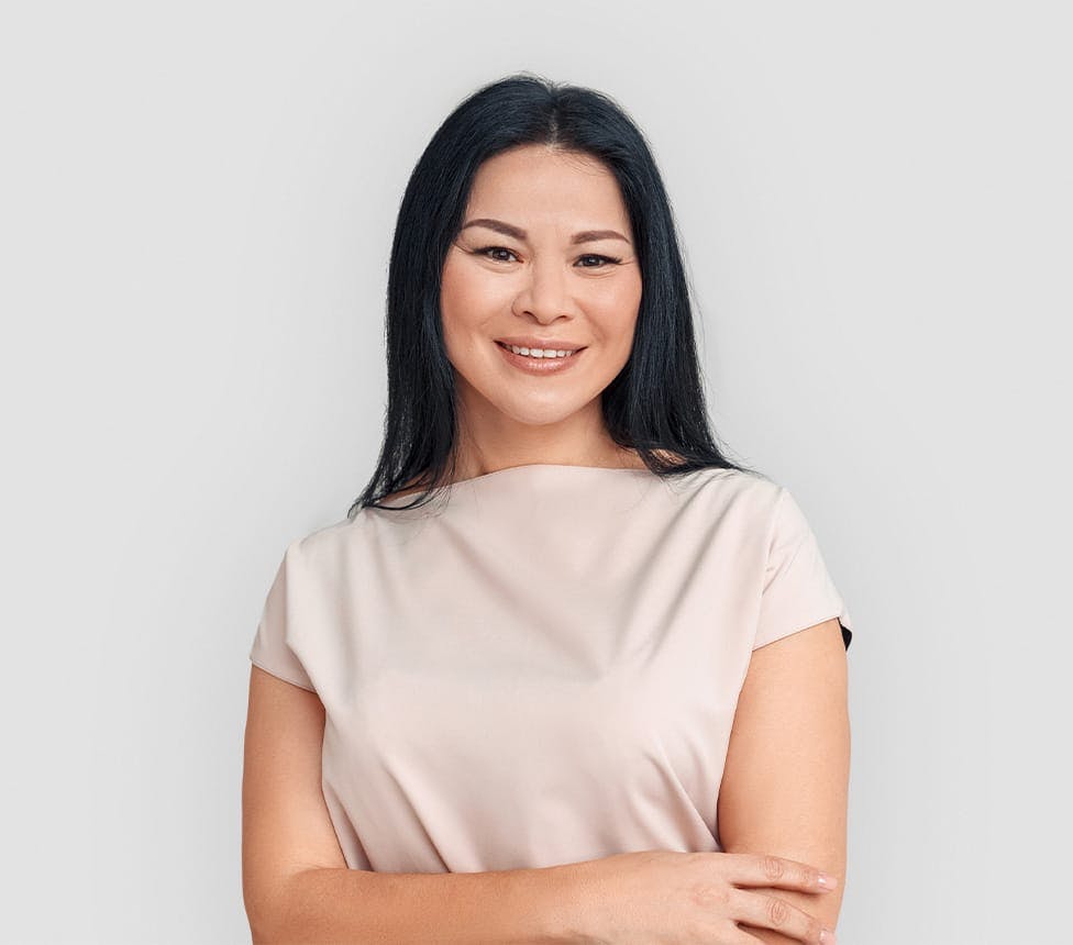 smiling woman crossing her arms