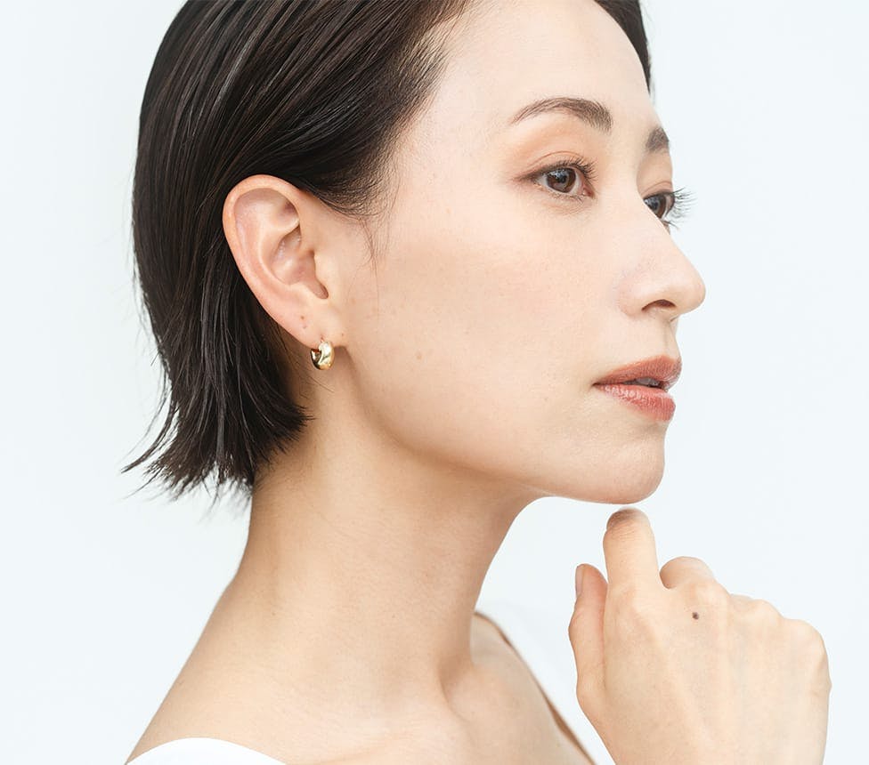 woman touching her chin