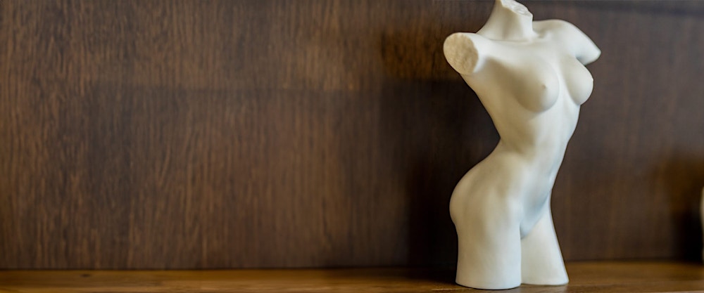 armless, headless, and legless statue of a naked woman's body