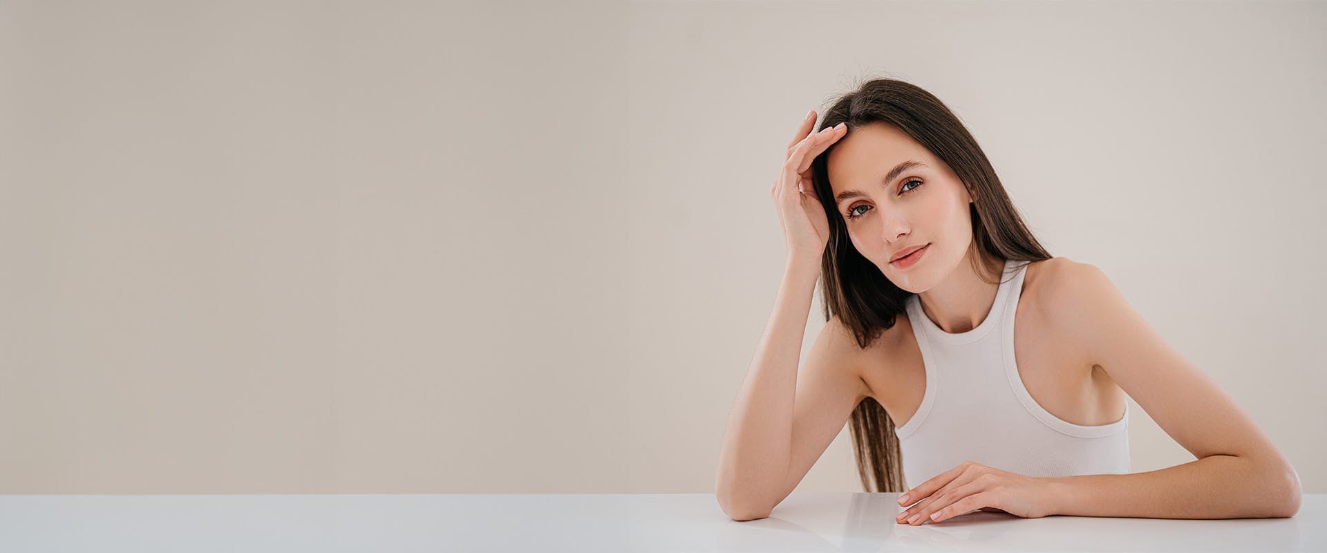woman leaning against her hand