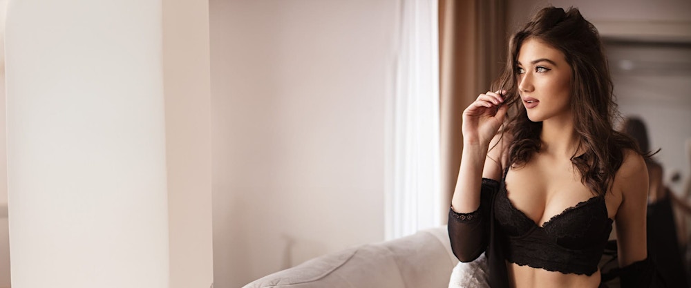 woman in a bra, playing with her hair